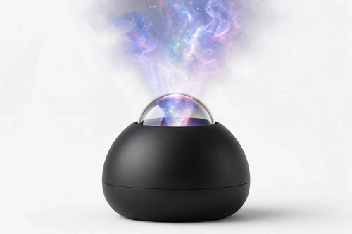 Black dome galaxy star projector on a white studio background, projecting a nebula upward
