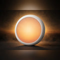 Sunrise wake-up light glowing on warm amber studio backdrop